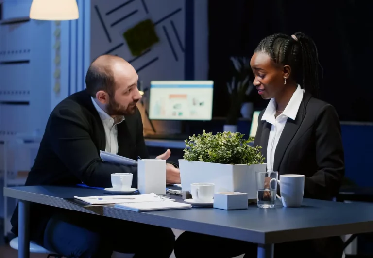 A man and a woman sit together at a desk